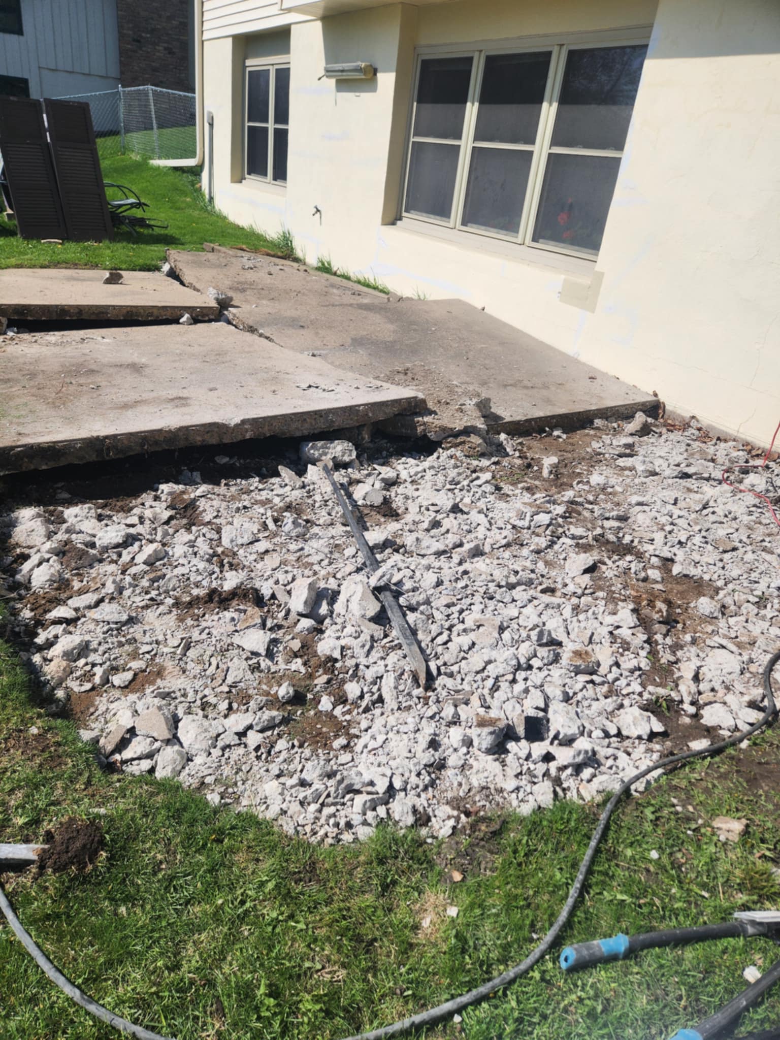 Concrete patio slab removal in Minneapolis MN — in progress